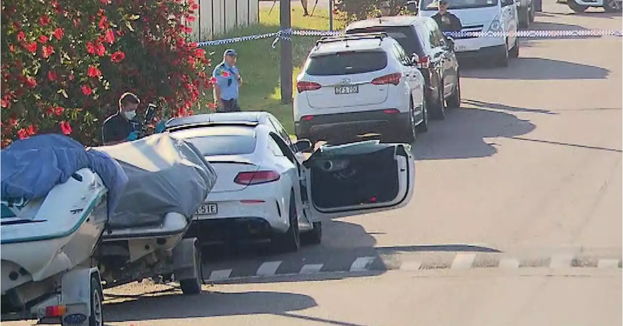 Police investigate drive-by shooting at luxury car in Sydney's west