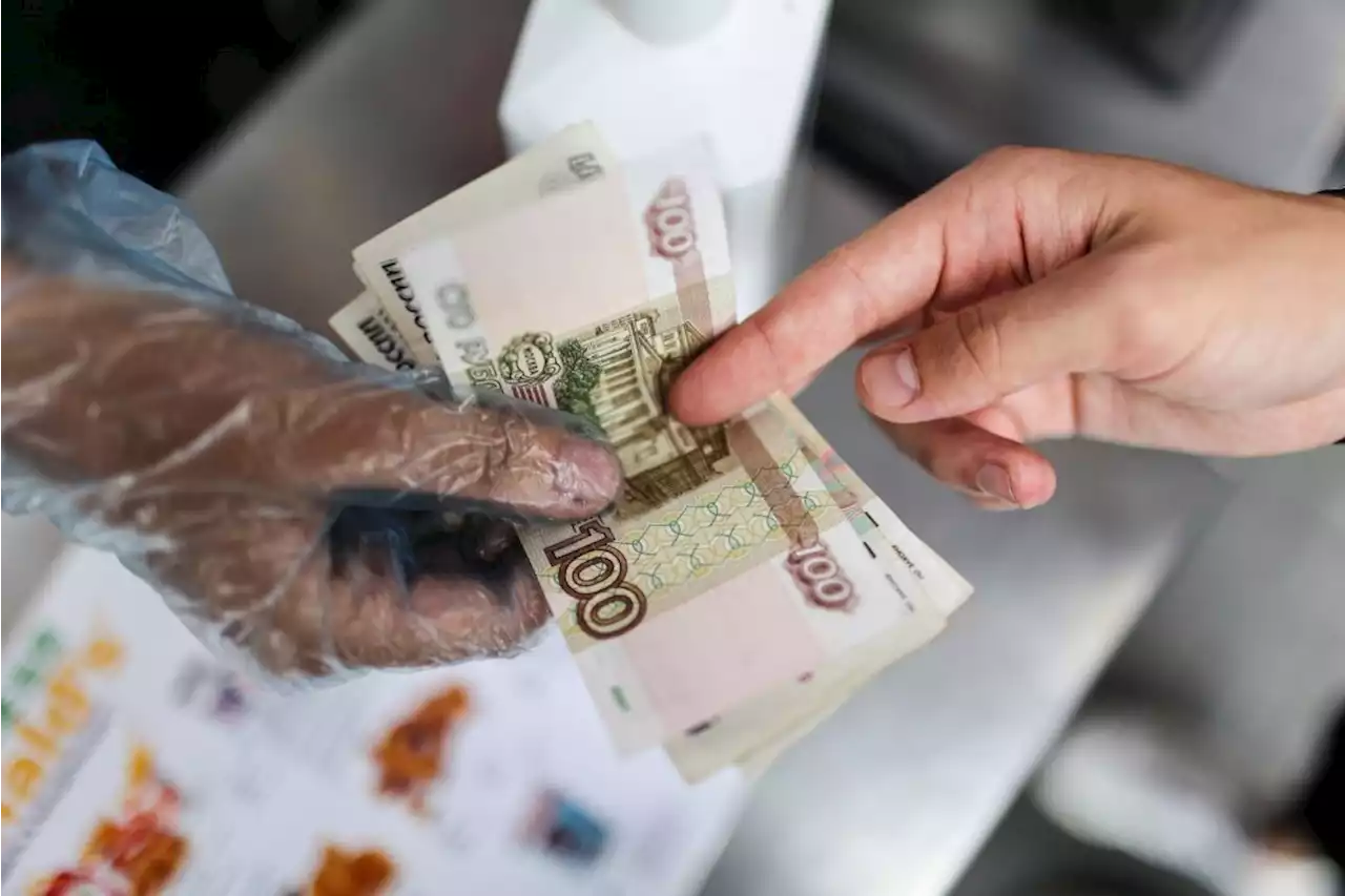 Rouble sinks back to 100 versus dollar in new headache for Russia