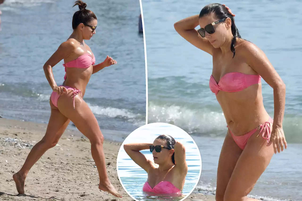 Eva Longoria frolics on Spanish beach in strapless pink bikini