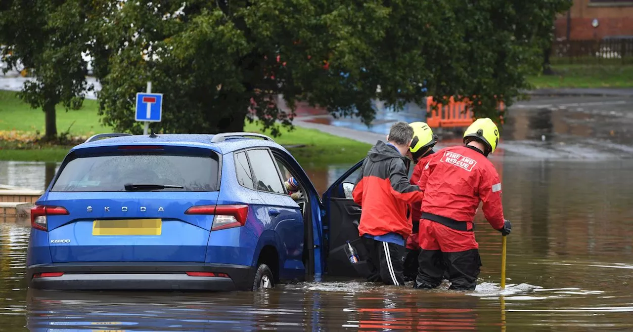 Man rescued from car by firefighters after West Lothian street floods