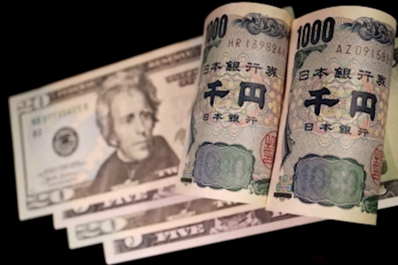 Dollar holds near ¥150 as c.bank policy, data deluge awaited