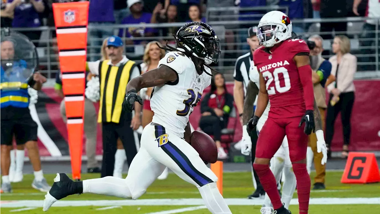 Edwards runs for three touchdowns to key Ravens' win over Cardinals