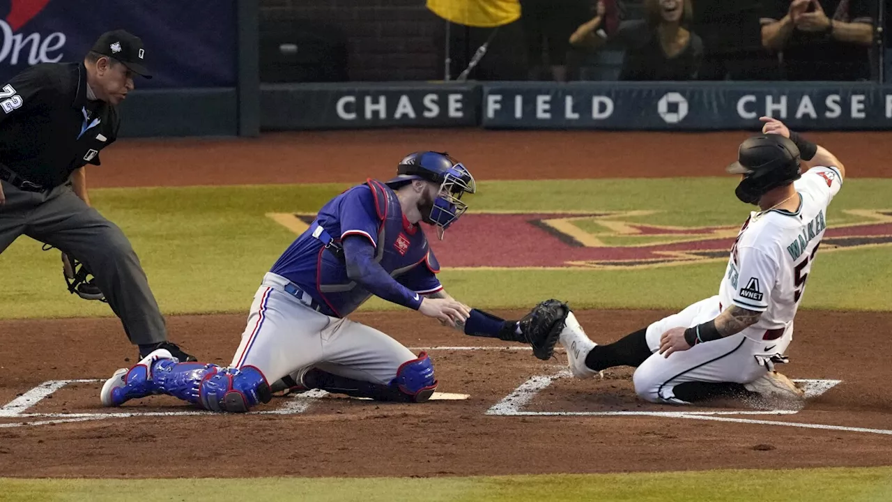 D-backs' Christian Walker blows through stop sign, hosed by Adolis García in Game 3 of World Series