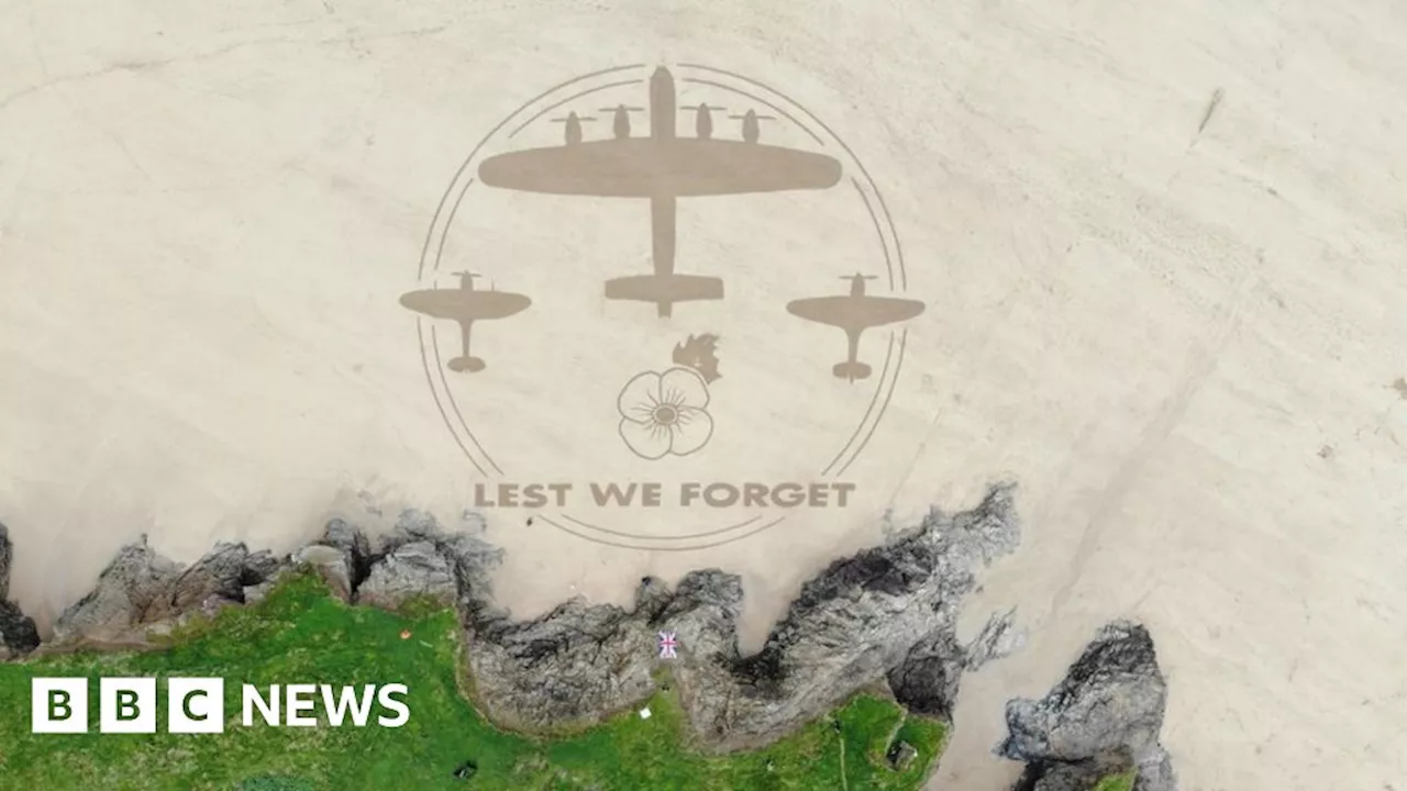 Remembrance planes sand drawing created on Cornwall beach