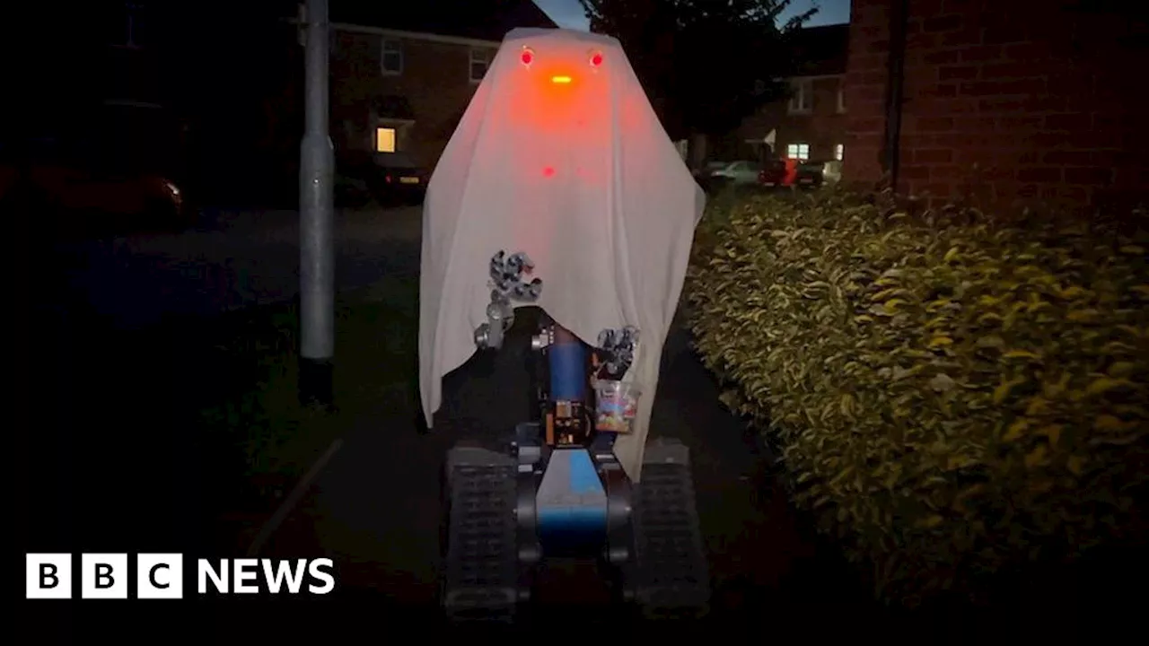 Replica of Short Circuit robot goes trick or treating as a ghost