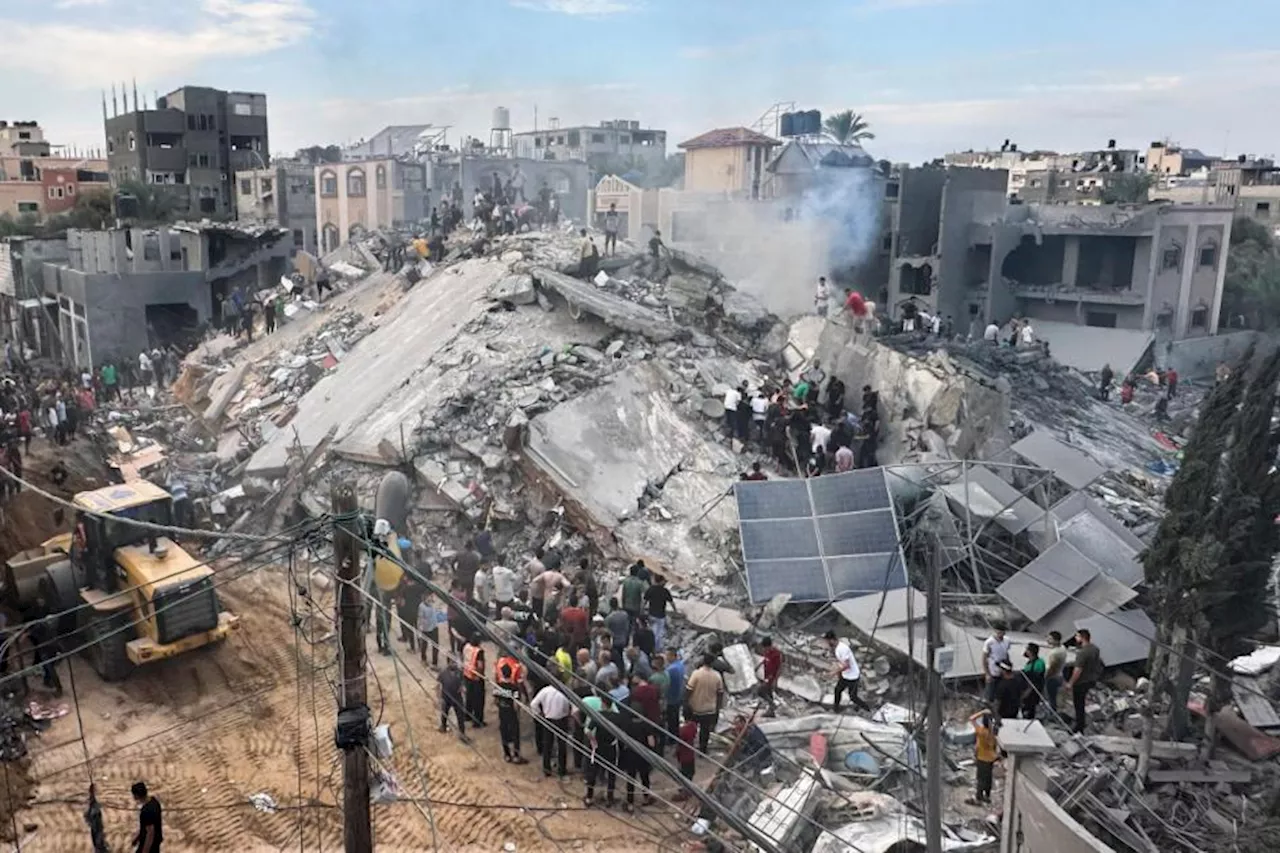 Israeli Air Strikes Level Apartment Buildings in Gaza Refugee Camp