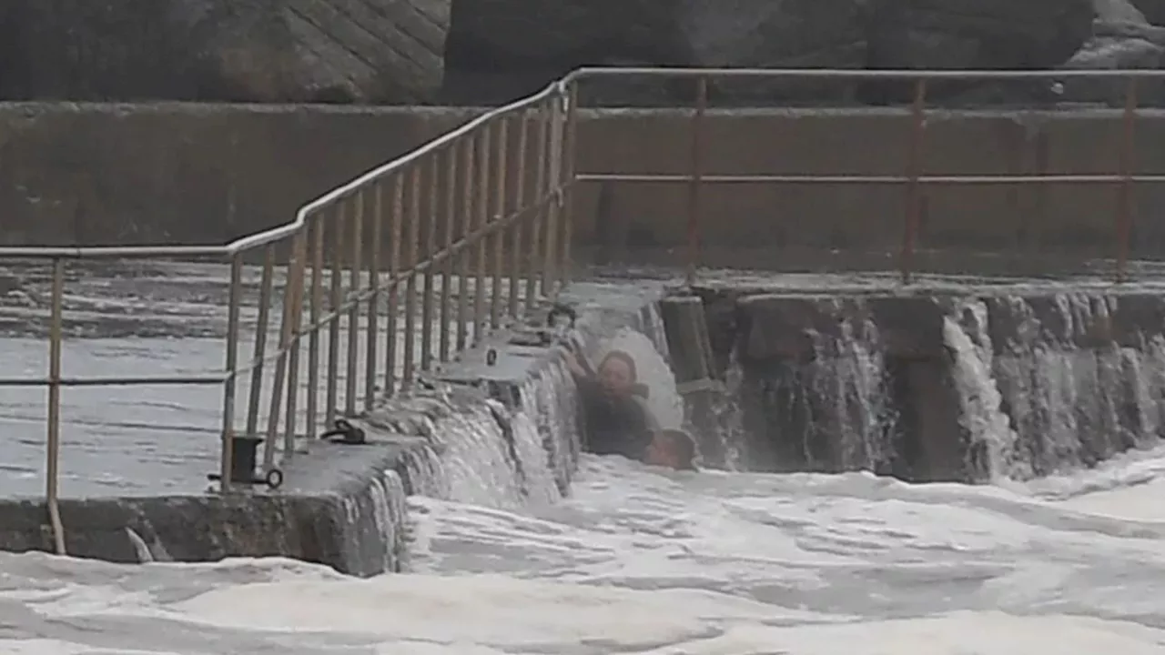 Dramatic Moment Couple Swept into Sea While Fishing