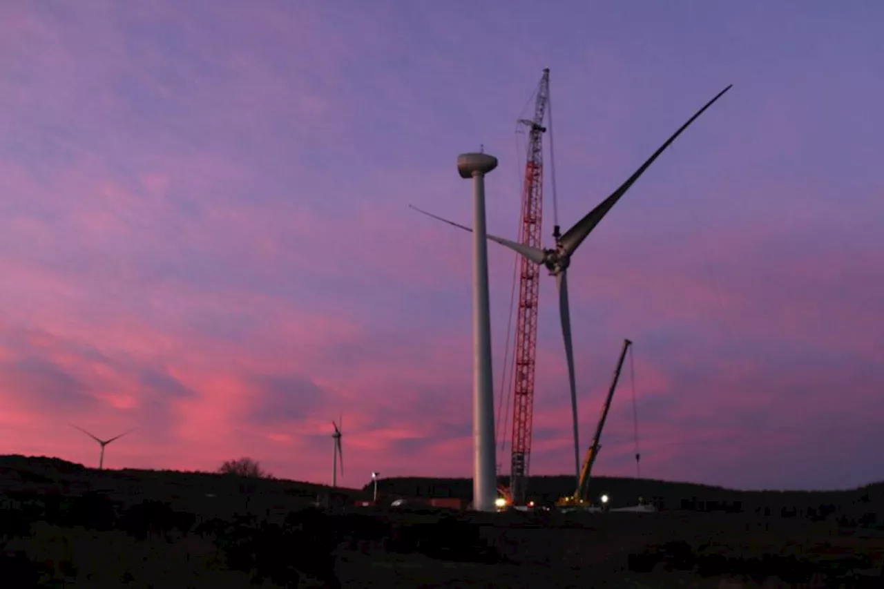 Turbines set up at 'UK's largest consumer-owned wind farm'