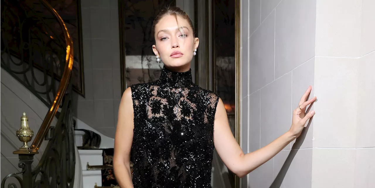 Gigi Hadid Wore the Littlest Lacy Black Dress Underneath a Gigantic Leather Jacket