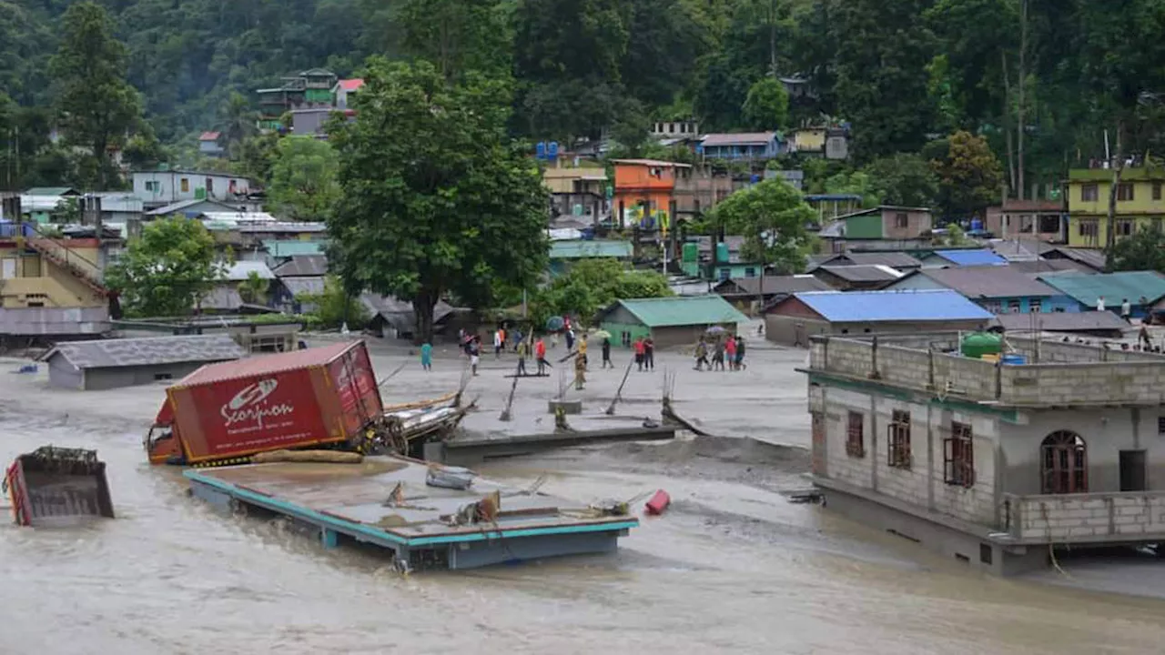 Flash floods kill at least 14 in India and leave more than 100 missing