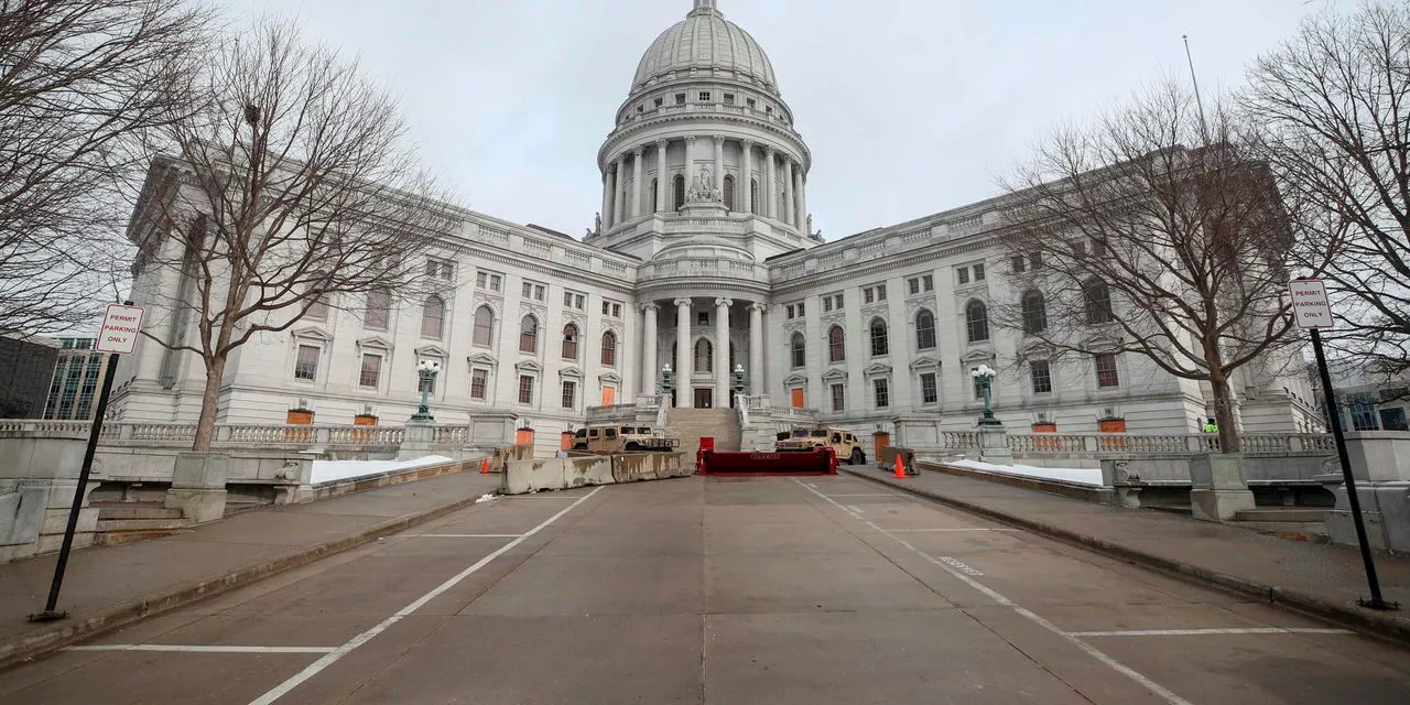 Man with handgun arrested at Wisconsin state capitol approached office of Democratic governor Evers