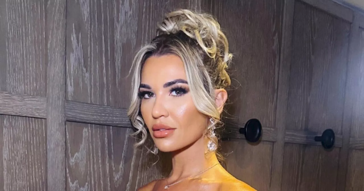 Christine McGuinness gives 'confirmation' while dazzling in plunging gown