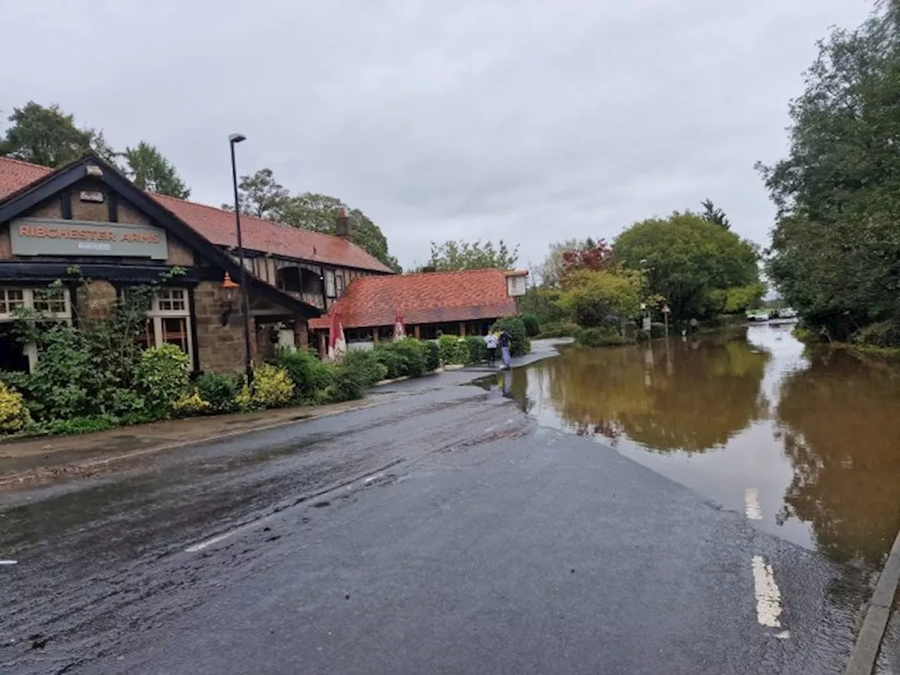 Heavy rain warning issued as River Ribble bursts banks at Ribchester