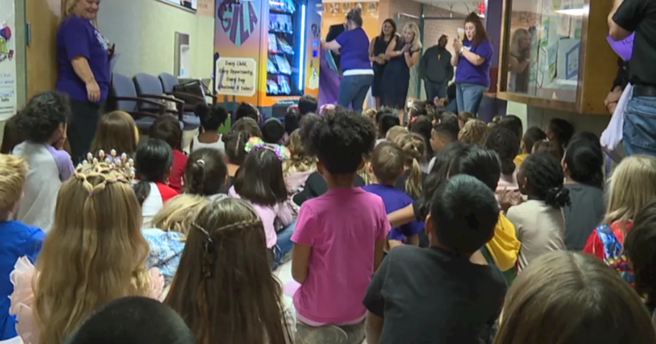 Teacher's granddaughter funds book vending machine at Henry Elementary