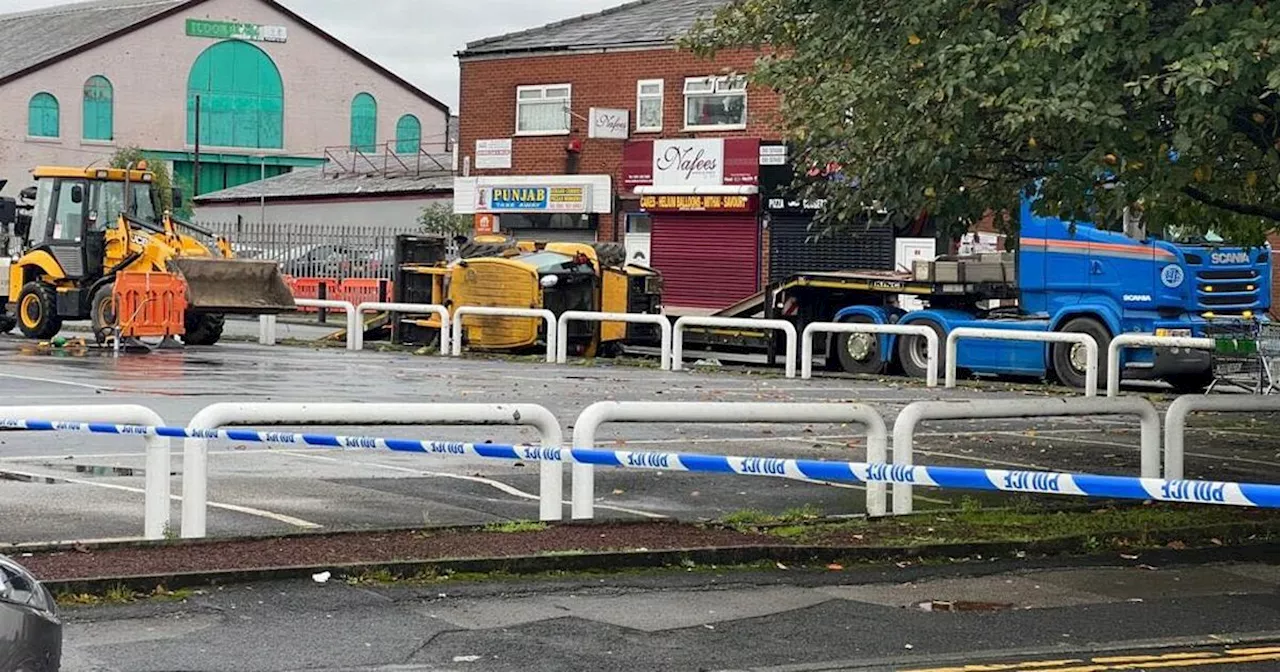 Man seriously hurt after he's trapped under digger that fell off lorry near Asda