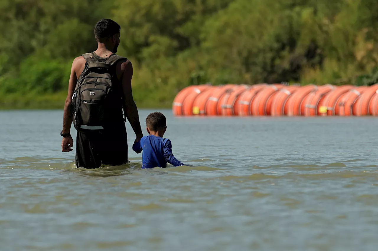 Texas asks appeal judges to let it keep floating barrier in place on the Rio Grande