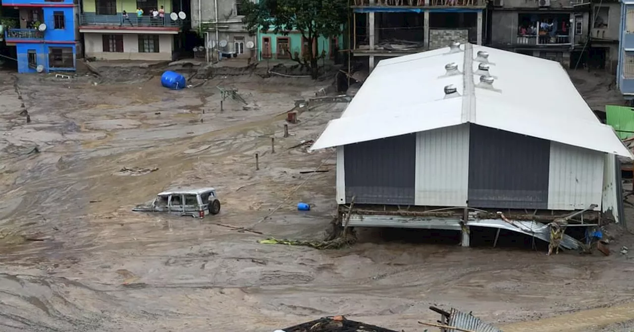 Icy floodwaters burst through major dam in India's northeast, killing at least 31 people