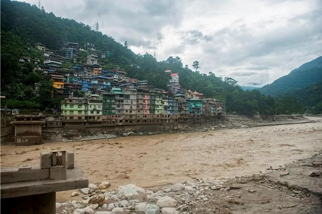 India lake that flooded was poised to get early warning system