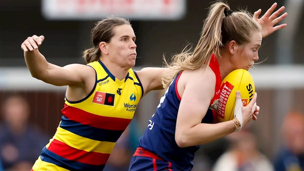 Crows beat Demons by 10 points to go outright top in AFLW as Magpies stun Lions