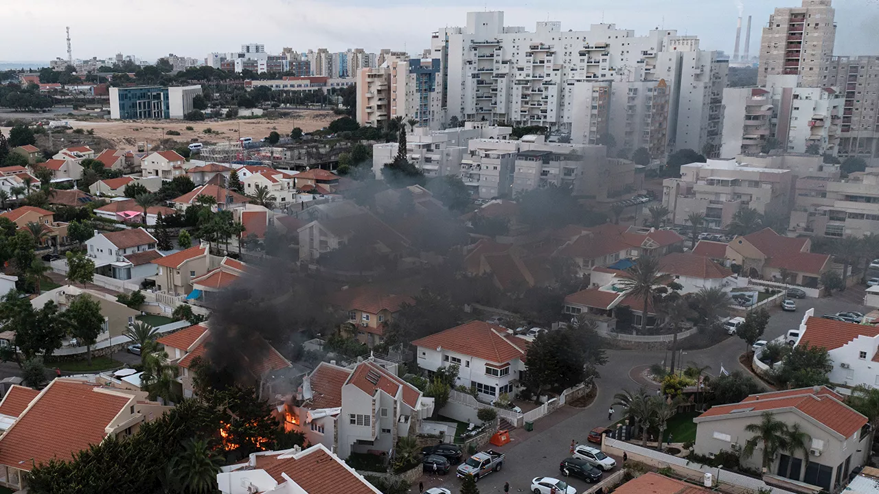 Rocket barrages strike southern Israel in operation claimed by Hamas, Netanyahu says Israel is ‘at war’