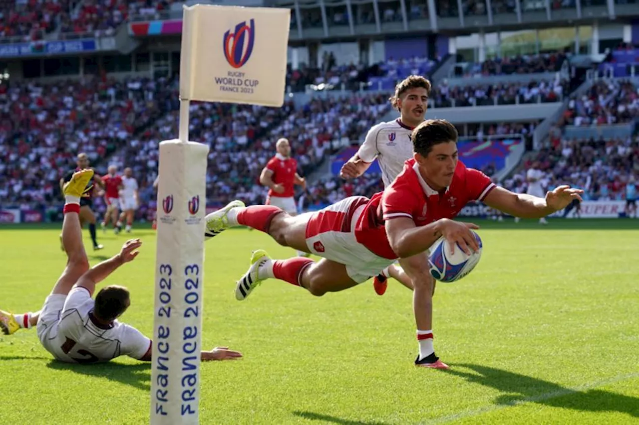 Louis Rees-Zammit claims hat-trick of tries as Wales comfortably top group