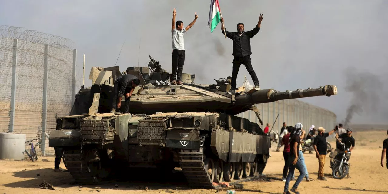 Hamas surprise attack out of Gaza Strip stuns Israel and leaves hundreds dead in fighting, retaliation