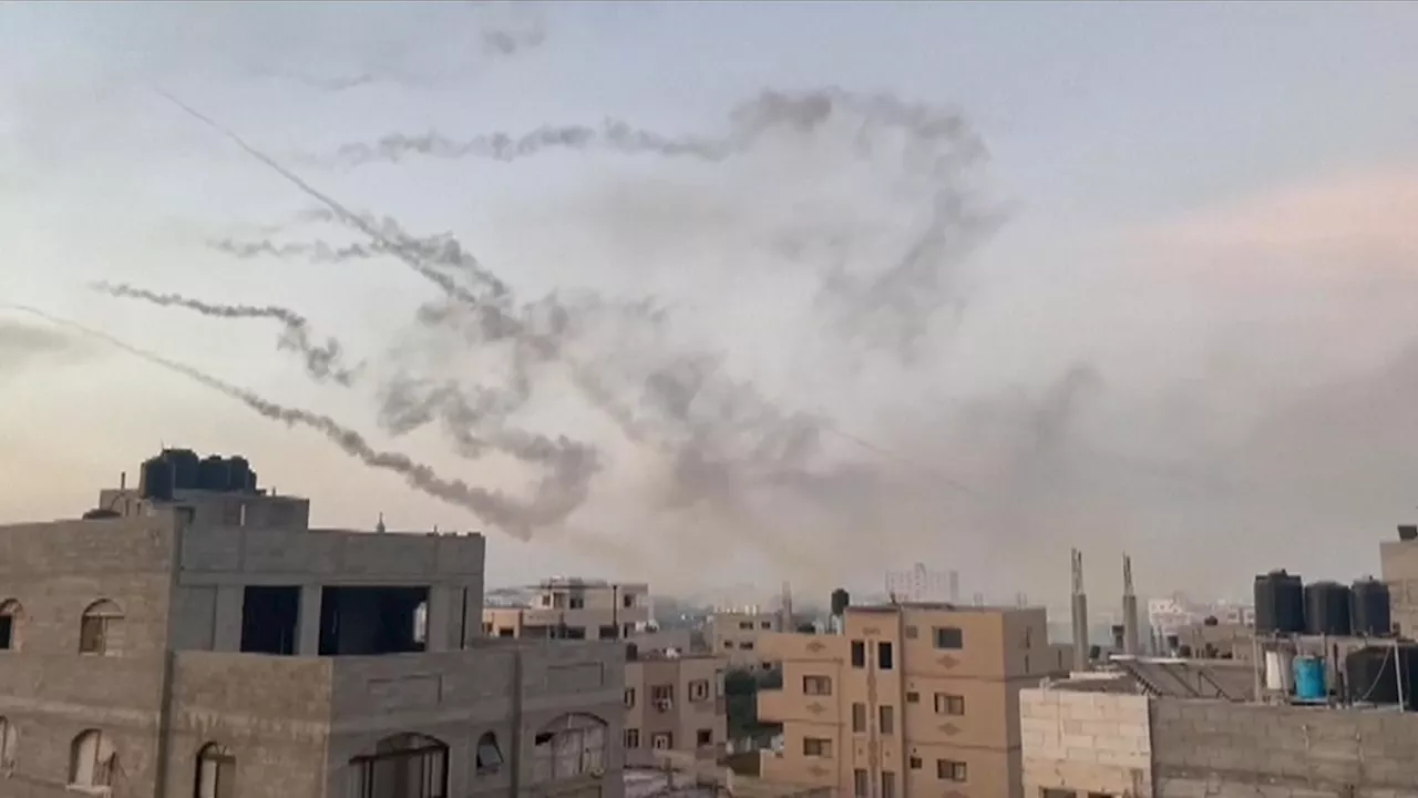 Thousands of rockets fired into Israel as video shows Palestinian fighters crossing border on paragliders