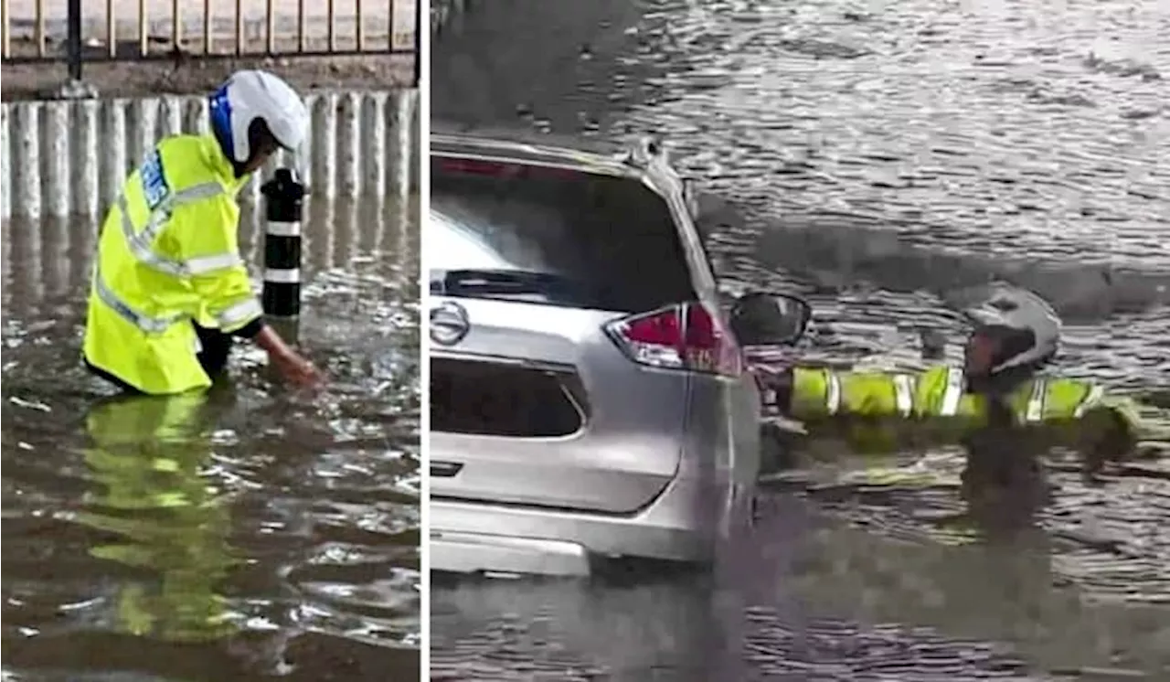 [Watch] Policeman’s Quick Action Saves XTrail Driver From Drowning In KL Flash Floods