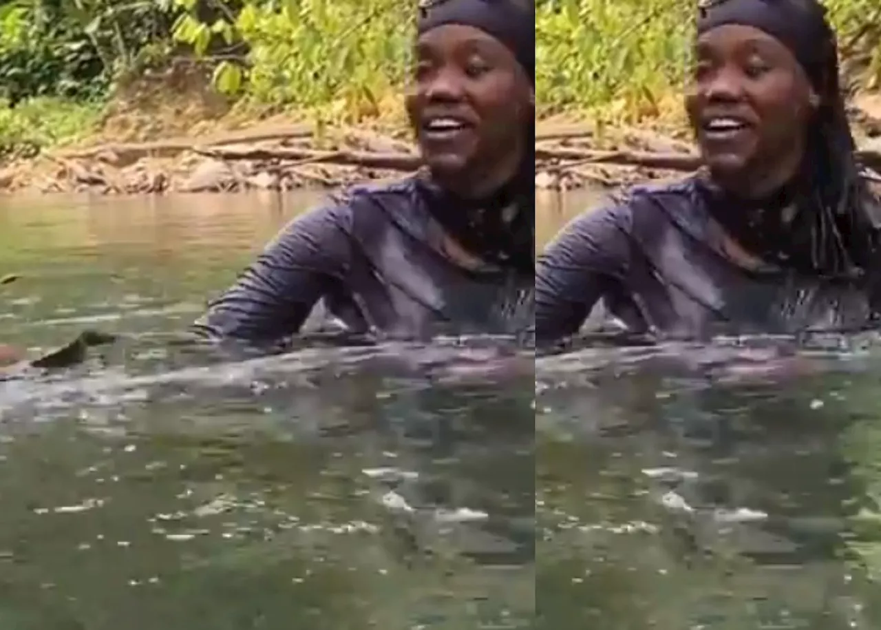 ‘Two besties playing😅’ Lady holds, happily toys with black snake in river [Video]