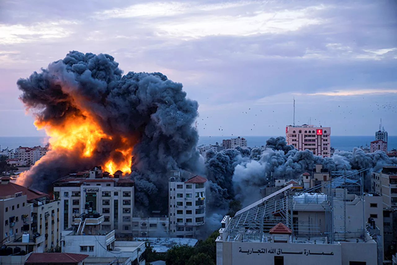 Hezbollah and Israel exchange fire as Israeli soldiers battle Hamas on second day of attack