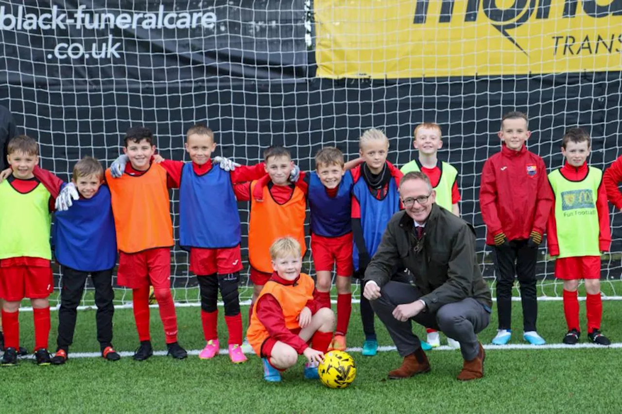 Glasgow football club praised by minister during visit