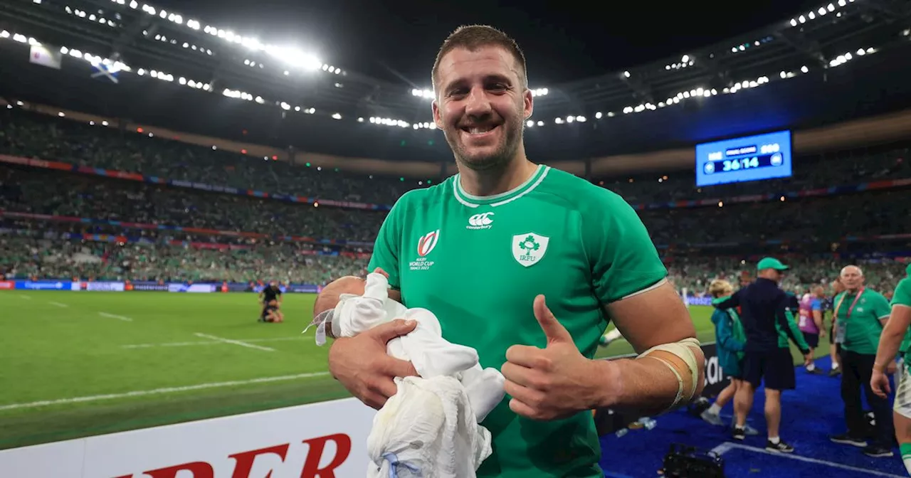 Stuart McCloskey celebrates with newborn baby son after Ireland's win v Scotland