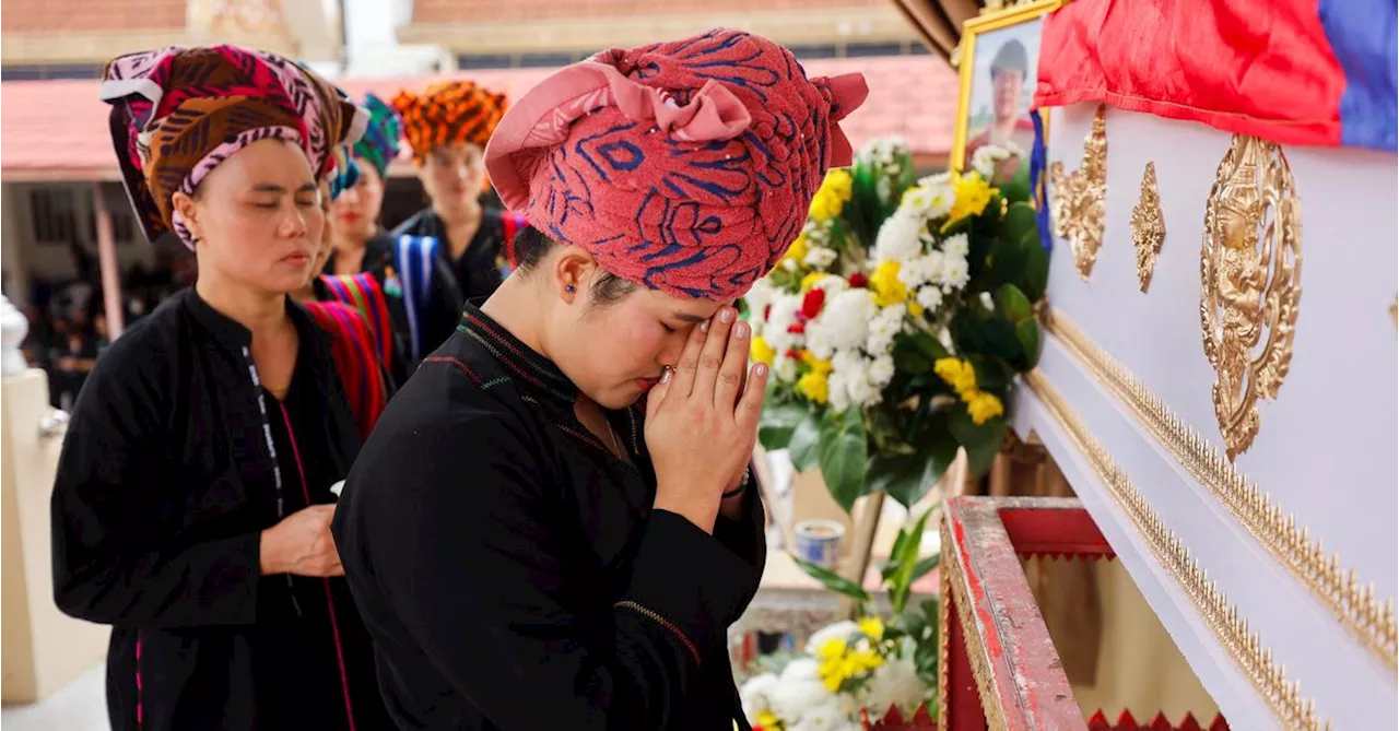 Thai mall shooting victim's mother bids emotional farewell at cremation