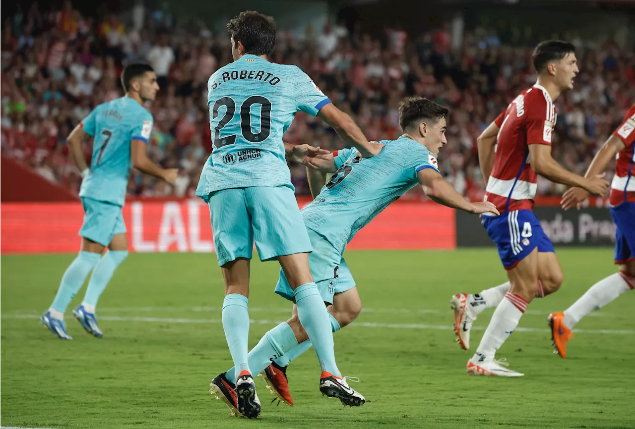 Soccer-Barcelona snatch 2-2 draw at Granada with late Roberto goal