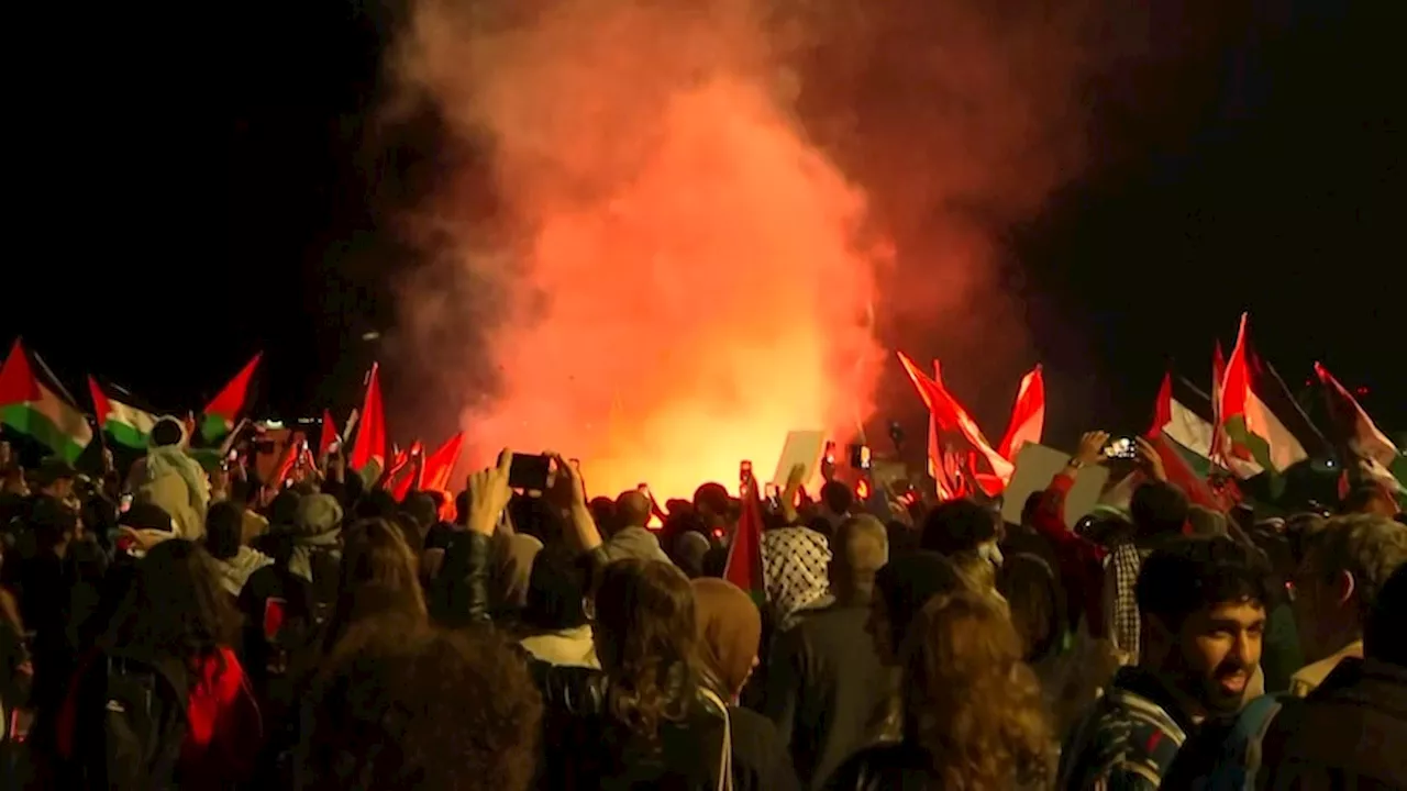 Flares ripped at Sydney Opera House as pro-Palestinian supporters protest against the lighting of sails in the colours of Israeli flag