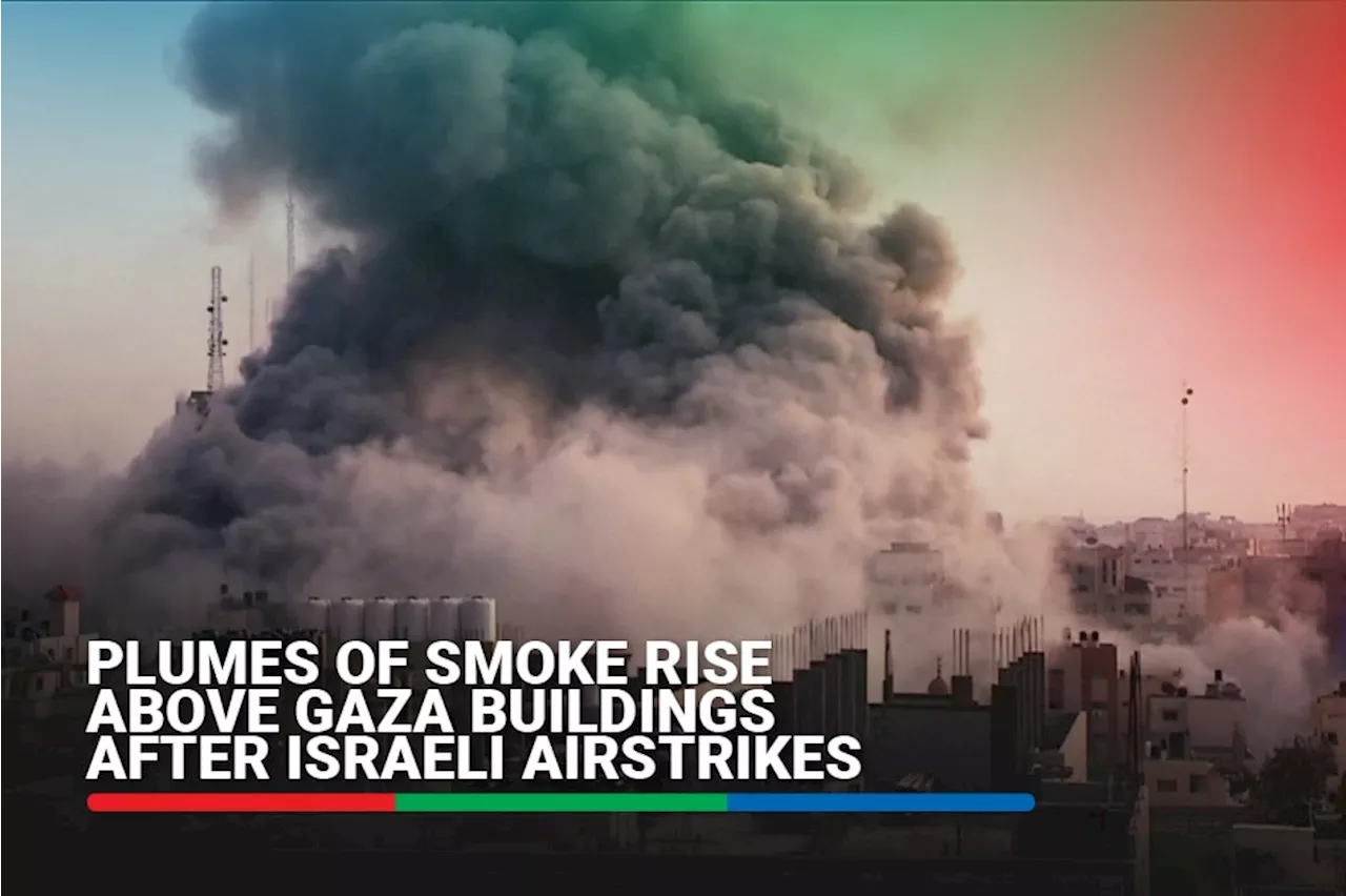 Plumes of smoke rise above Gaza buildings after Israeli airstrikes