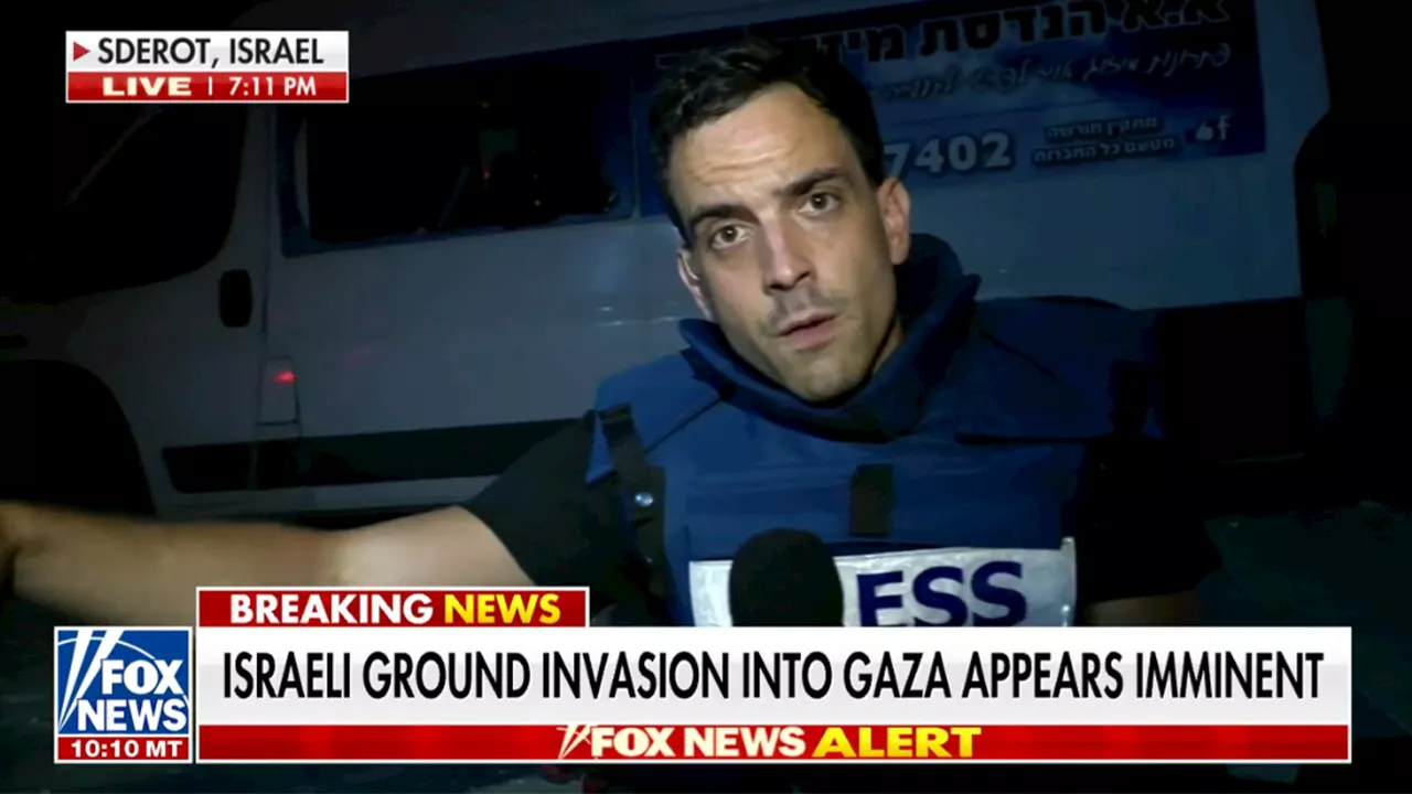 FOX News’ Trey Yingst takes cover from Hamas rocket attack during live report