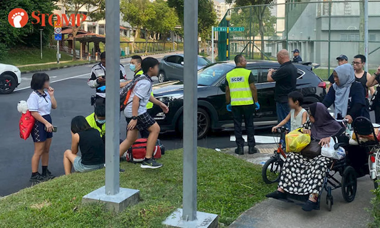 Car driver assisting with investigations after accident with cyclist in Bukit Batok