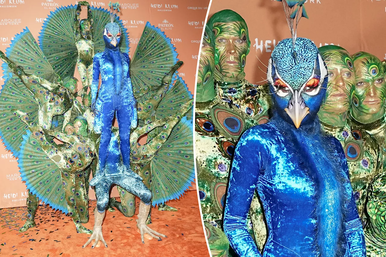 Heidi Klum dresses up as a giant peacock for her annual Halloween party