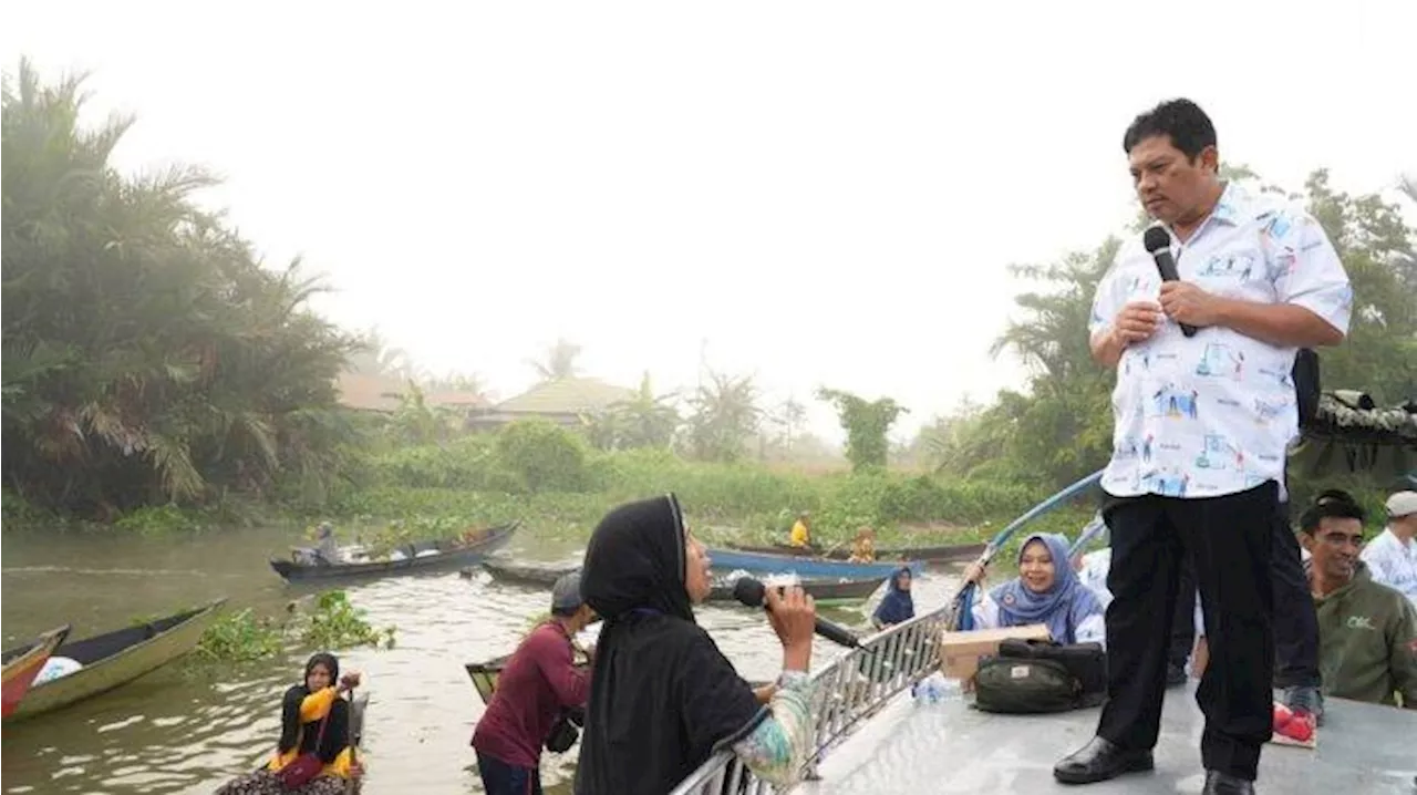 Dirut BPJS Ingatkan Pedagang Pasar Terapung Lok Baitan Martapura Rajin Cek Kartu Kepesertaan JKN