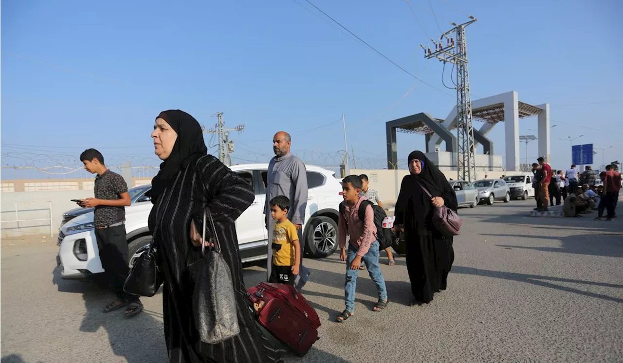 Foreign passport holders enter Rafah crossing from Gaza to Egypt