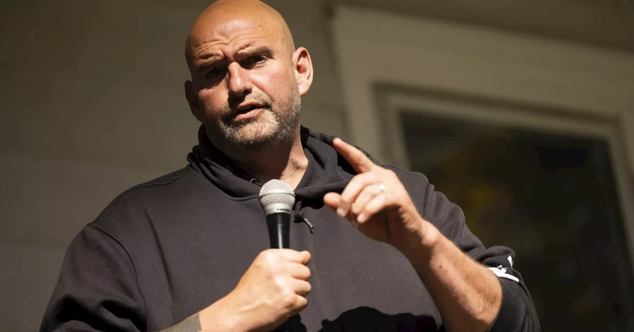 John Fetterman trolls protesters outside Senate demanding ceasefire by waving Israel flag at them