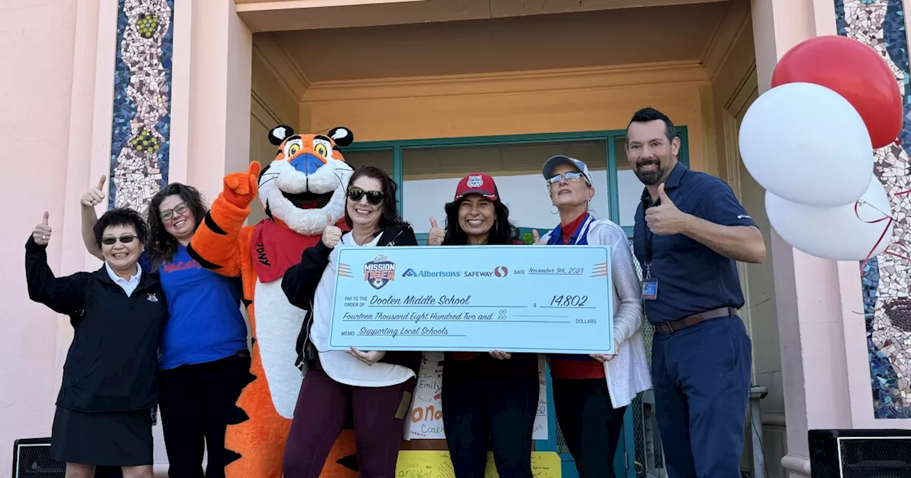 Sports are 'Grrreat': Tony the Tiger brings check to a Midtown middle school for sports equipment