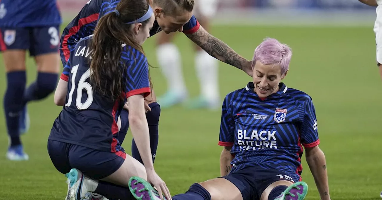 Megan Rapinoe hobbles off the pitch after injury early in the final match of her career