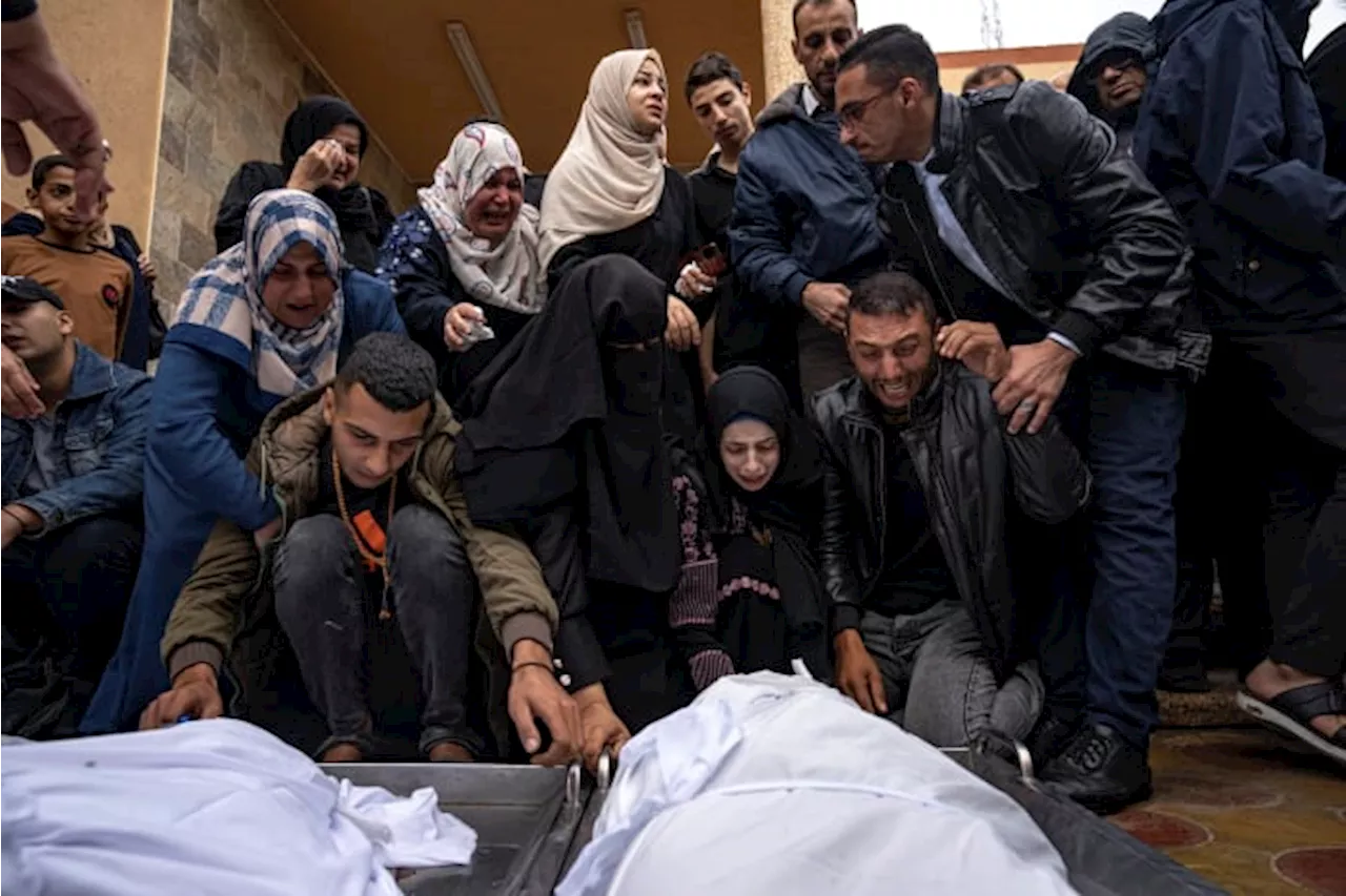 Palestinians Mourn Relatives Killed in Israeli Bombardment of Gaza Strip