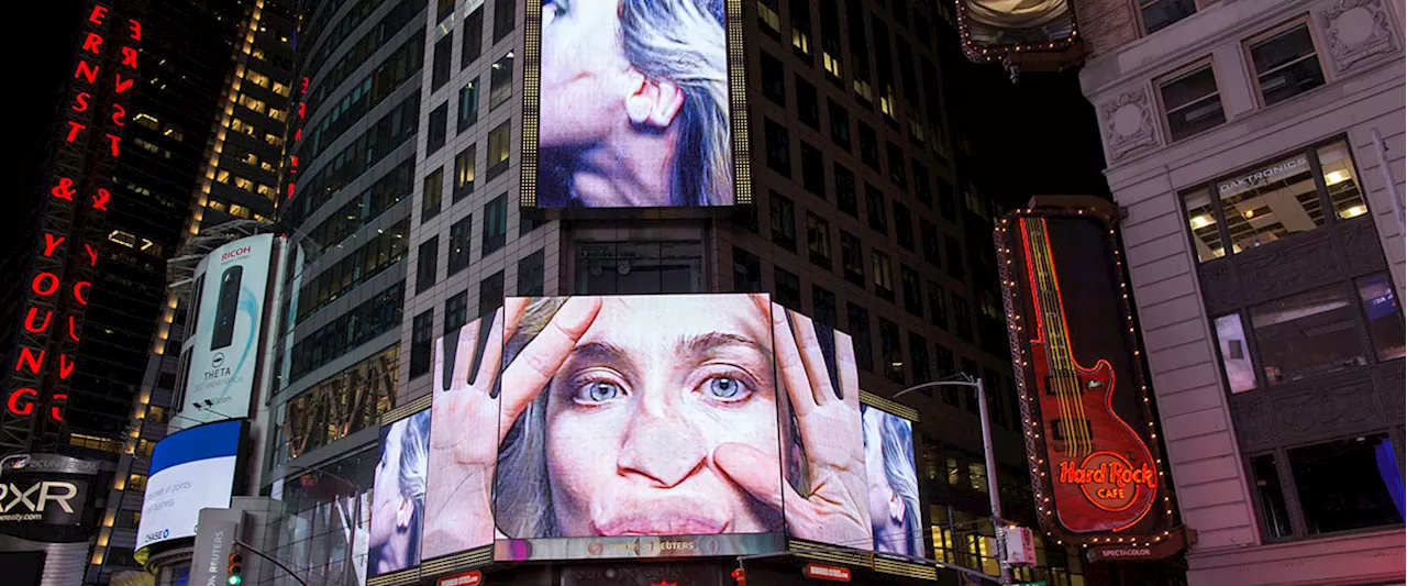 Woman's Face Displayed on Times Square Billboards