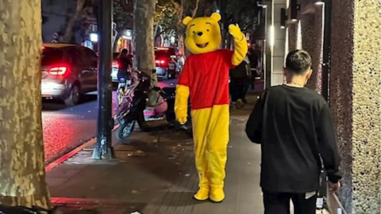 Halloween revellers party in Shanghai, some wearing costumes seen as a protest against China's policies