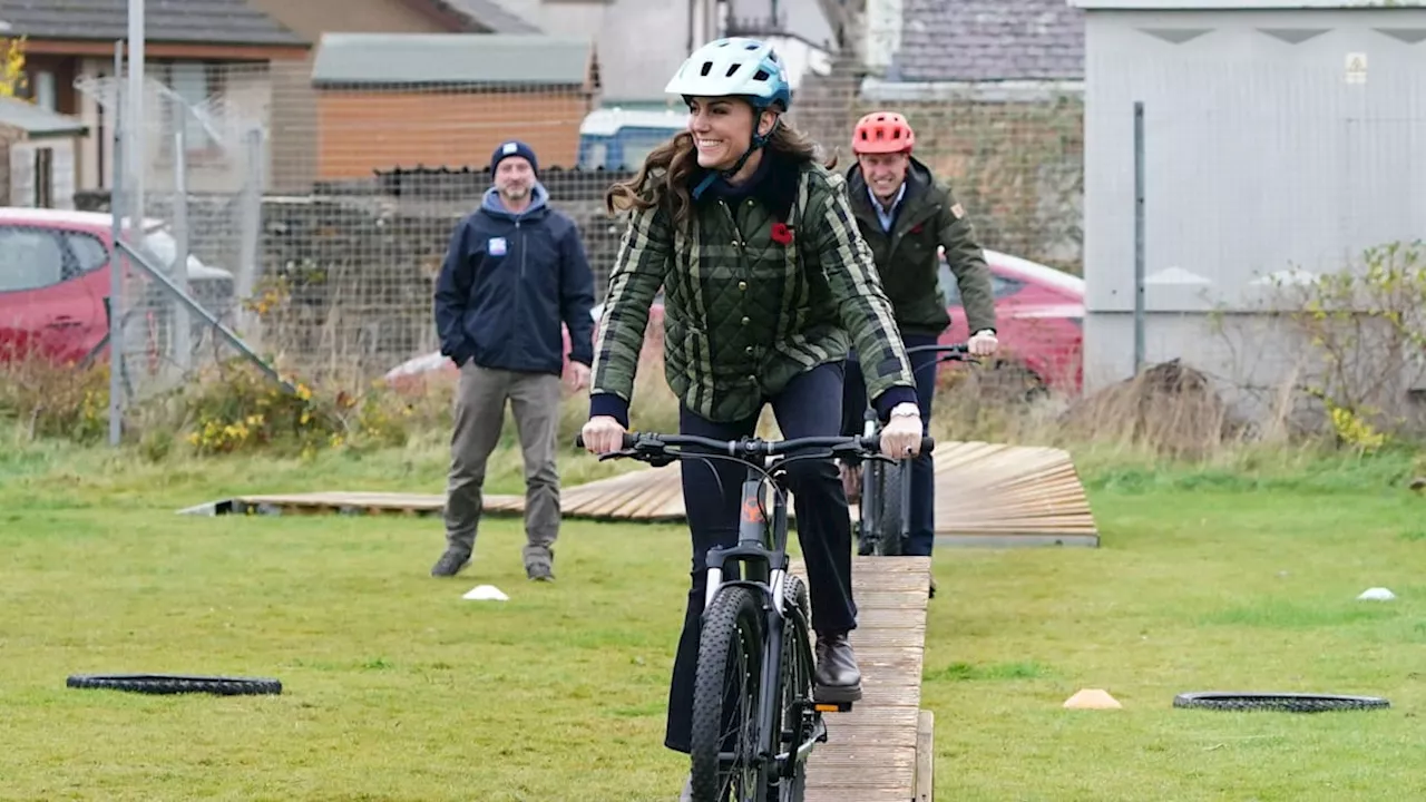 The Prince and Princess of Wales jump on mountain bikes in Scotland