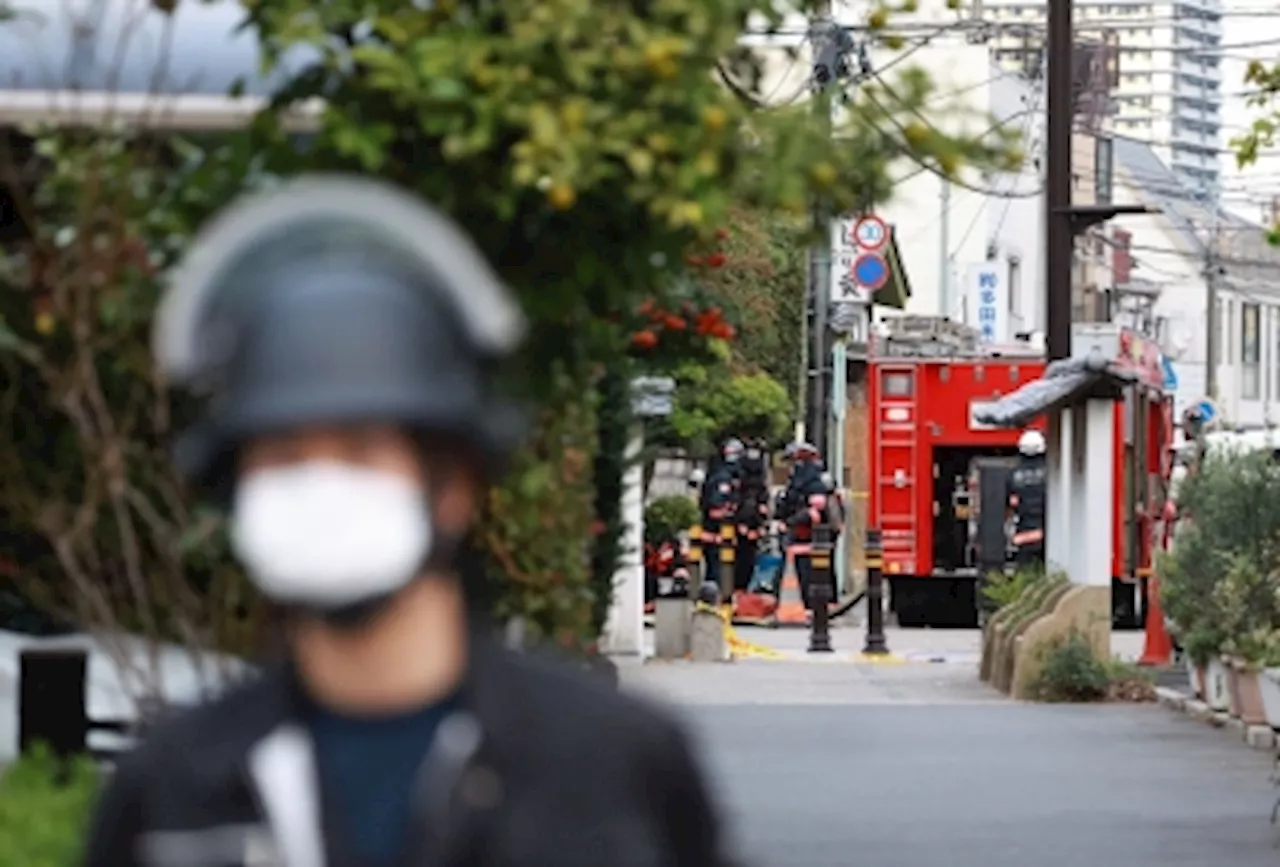 Elderly Japanese hostage taker ‘had grudge’ with post office