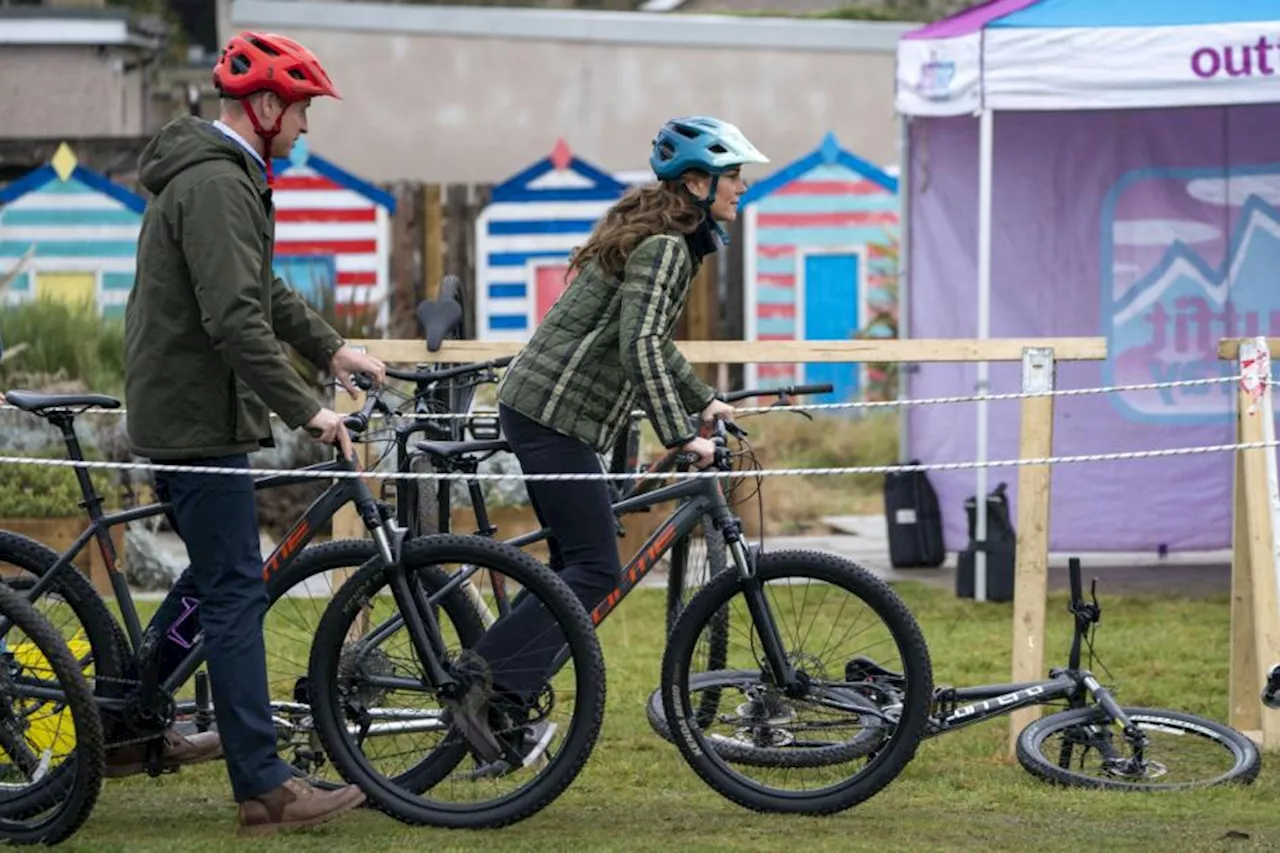 William and Kate cheered on as they show off bike skills